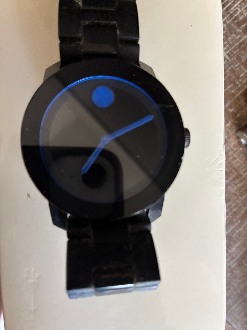 Movado Black Watch with Blue Hands and Accent